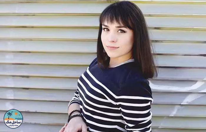 Woman with long bob hairstyle with thick wispy bangs