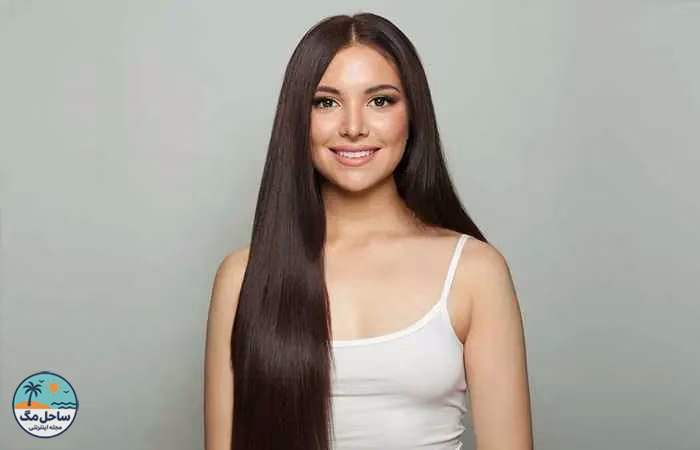 Woman with long sleek hair with middle parting