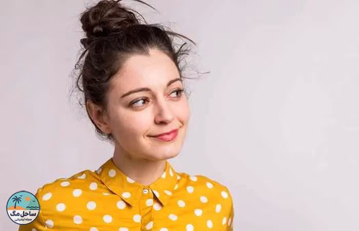 Woman with messy high bun hairstyle&nbsp;