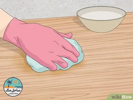 Step 4 Rinse the wood with clean water.