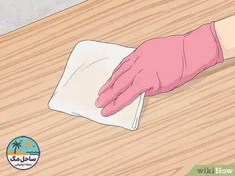 Step 5 Pat the wood dry with a clean cloth or towel.