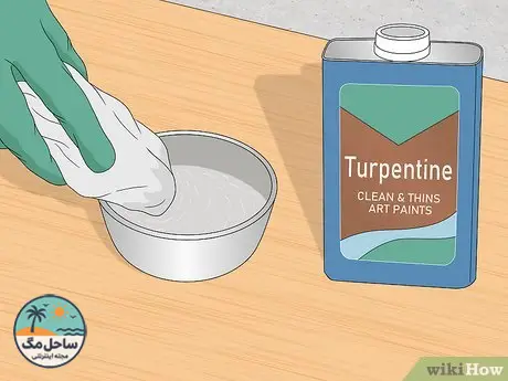 Step 1 Apply a small amount of turpentine to the corner of a white cloth.