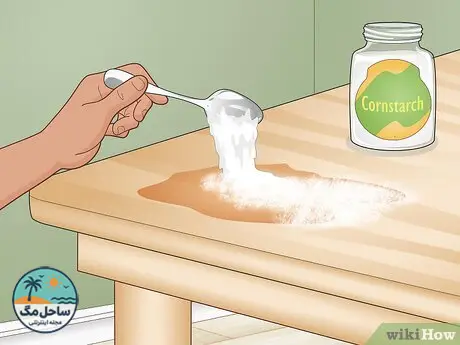 Step 2 Apply cornstarch to indoor wooden furniture.